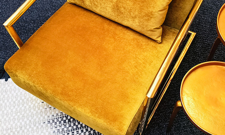 gold colored modern chair
